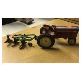 Vintage International toy tractor w/ plow.