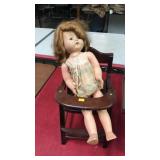 Vintage doll w/ high chair.