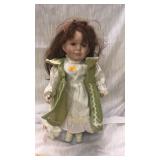 Doll on stand.  16" hi