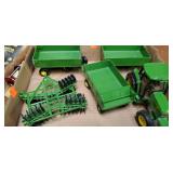 Flat of John deer tractors, wagons and disk