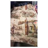 Hunting / fishing design quilt. Yarn knoted.