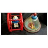 2 vintage toys...spinning top and  rolling smurf