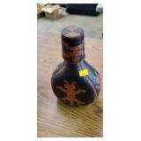 Trible leather cover over decanter