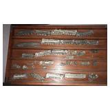 Miniature Pewter trains.  In wood case.