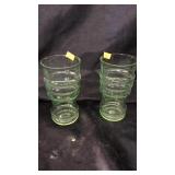 2 green ware glasses.