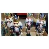 4 nut crackers,  one has loose head