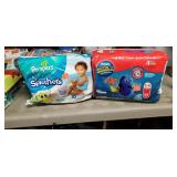 1 bag pampers splashers (med)& 1 bag huggies