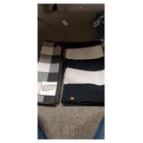 2 reversible throw rugs