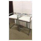 2 high top bar stools. Chrome & faux leather.