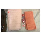 Bath towel.  Hand towel.  Toothbrush.