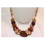 NEW DIRECTIONS LONG BROWN/GOLDTONE NECKLACE