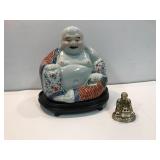 Porcelain and a brass Buddha.