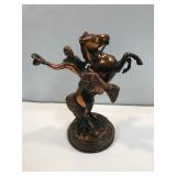 Bronze 12" tall. A leg has been repaired