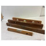 4 antique wooden levels.