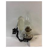 Coil oil lamp with cast iron wall mount sconce