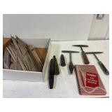 Welding rods. Chipping hammers. Cable ends.