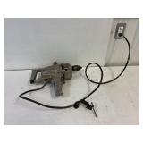 1/2' reversible drill. Works.