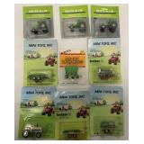 (9) 1/64 tractors and equipment on blister packs