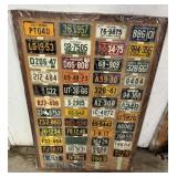Minature Plates mounted on  piece of plywood