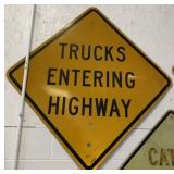 Metal Trucks Entering Highway Road Sign