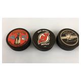 3 NHL Hockey Pucks