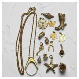 Gold tone jewelry pendants, cameo, etc