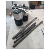Propane bottles and tent stakes