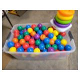 Tote of Plastic balls & Fisher Price toy