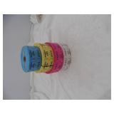 four rolls of tickets