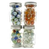Marbles in (4) Glass Jars
