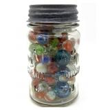 Shooter Marbles and Marbles in Glass Jar