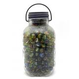 Marbles in Lidded and Handled Glass Jar