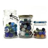 Shooter Marbles and Marbles in (3) Small Glass