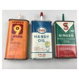 set of vintage oil cans