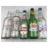 collection of old soda bottles