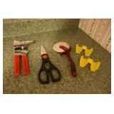 Can opener pizza cutter taco holders and scissors Can opener pizza cutter taco holders and scissors