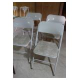 4 Metal white fold up chairs 4 Metal white fold up chairs