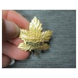 Police maple leaf pin