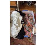Bin of blazers and dresses