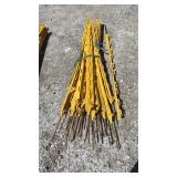 Bundle of yellow stakes