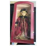 Porcelain doll in case