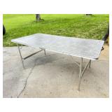 Coleman Folding Table with Wood Grain Pattern