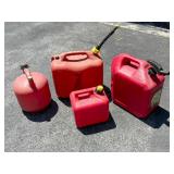 Four Red Plastic Gasoline Cans