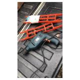 Black an decker power tool and ext.cord wrap
