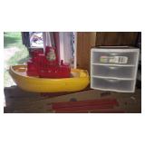 A kids toot and float boat & clear 3 drawer