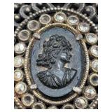 Vintage silver-plated Art Nouveau-style compact enhanced with cameo center surrounded by clear stones (some are missing)