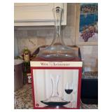 (2) clear glass Wine Enthusiast carafes…..one is box is tightly wrapped…..also includes 2-piece wine funnel set
