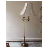 Brass base swing arm floor lamp…..not tested and shade has staining
