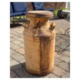 Vintage metal milk can with lid…..has dents and rust…..25-1/2” tall