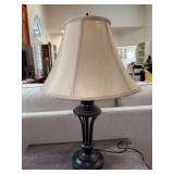 Nice looking bronze-like finish lamp with beige silk-like shade…..24” tall